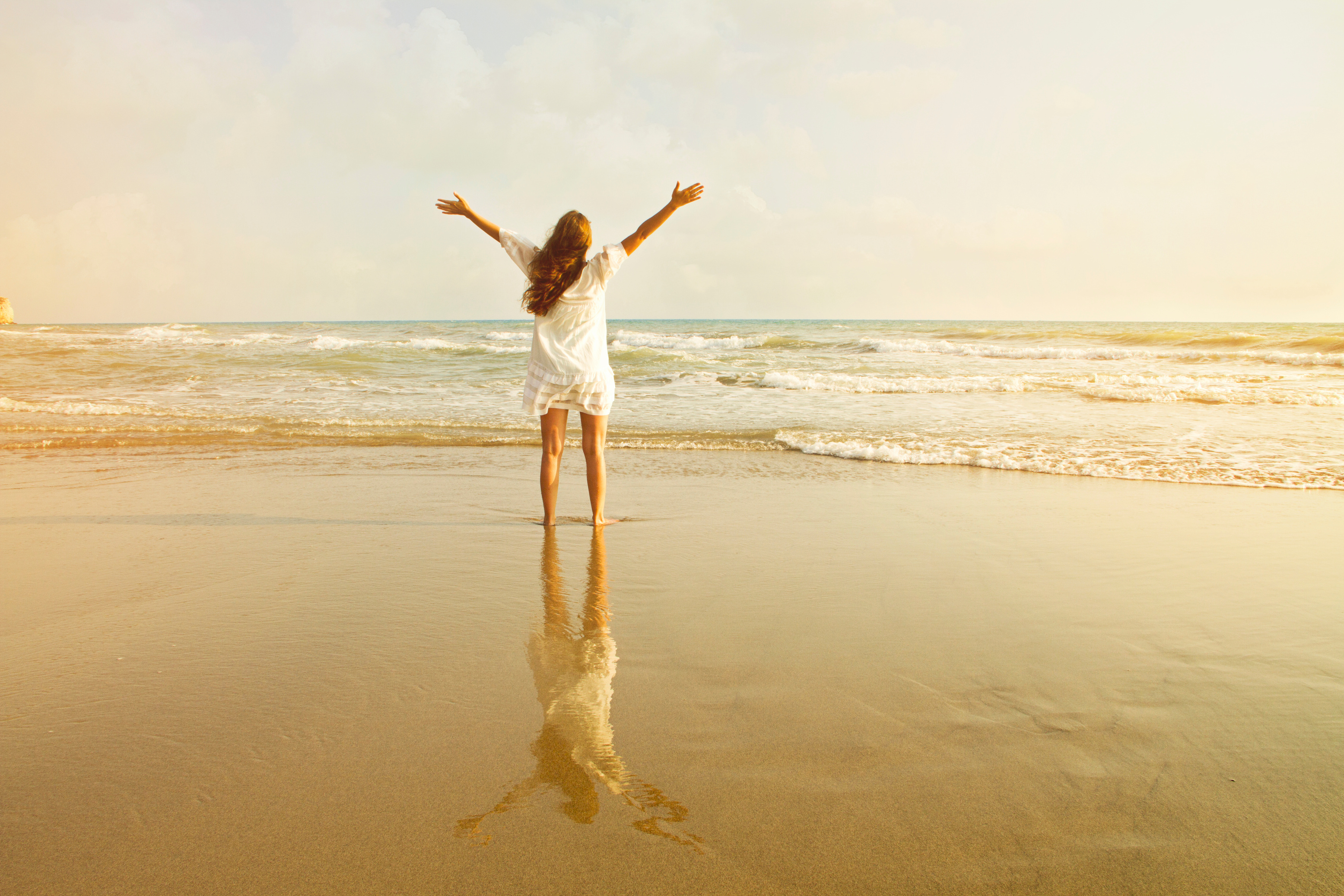 Dreamy girl on beach