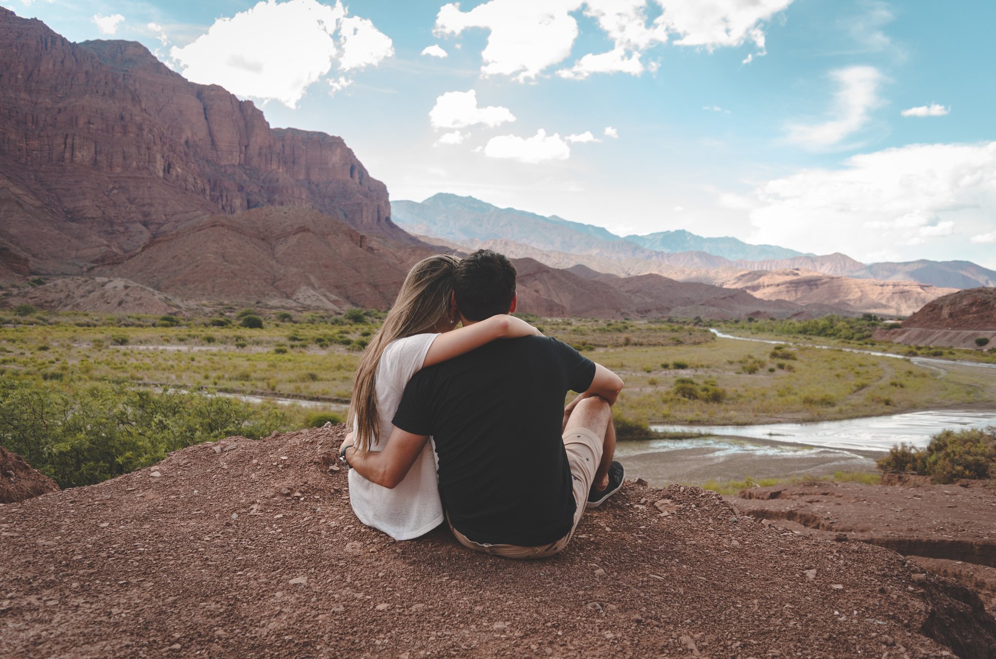 Man And Woman Sitting On Ground