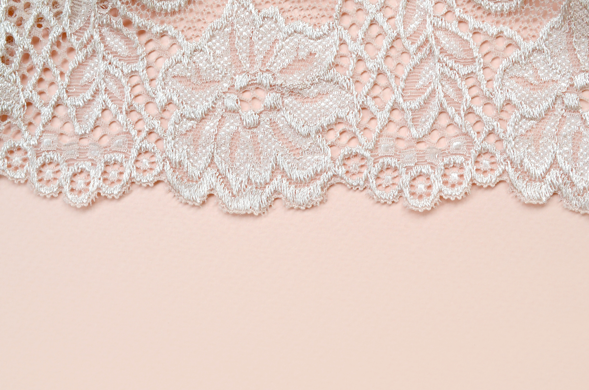 White Lace Fabric on Pink Background 