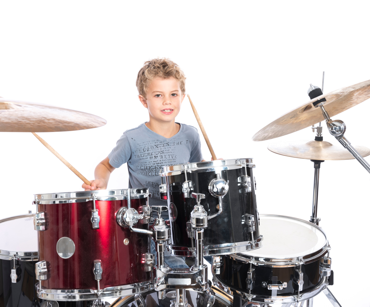 Young Boy Plays Drums