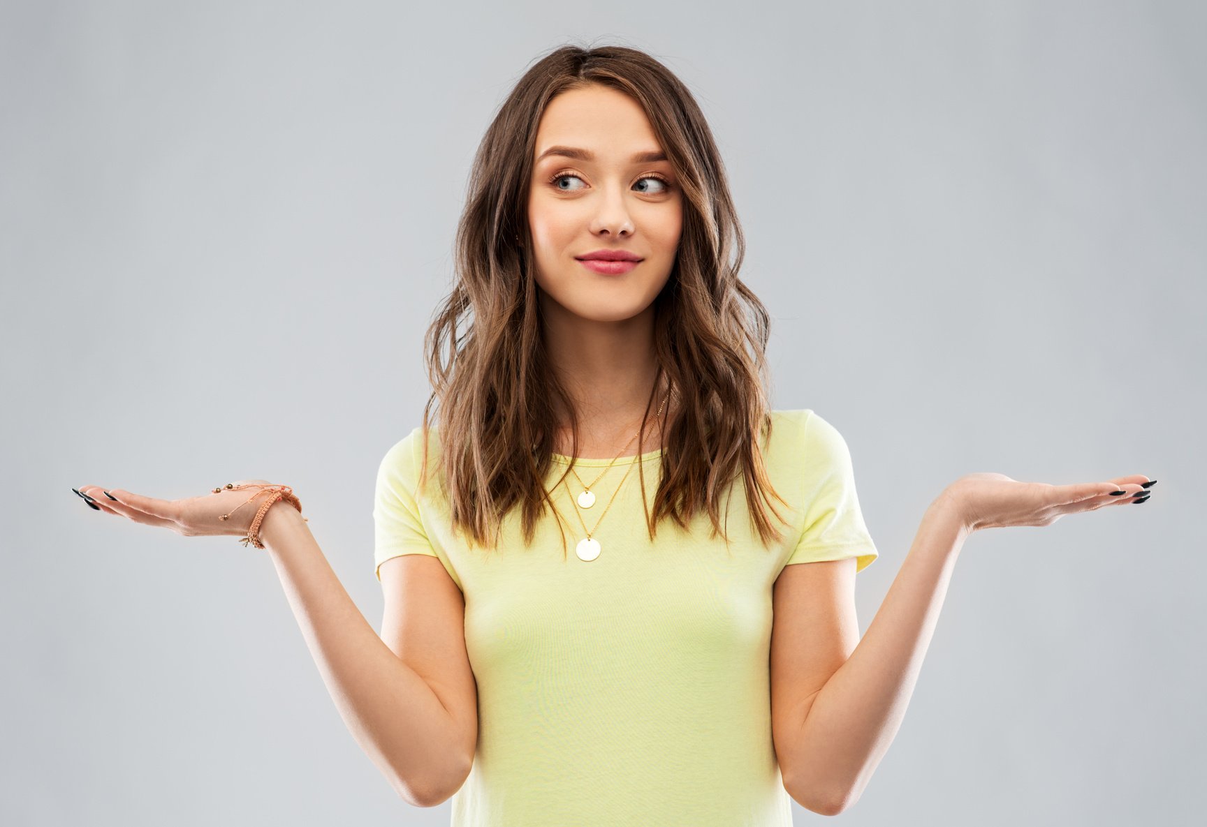 Happy Teenage Girl Holding Something Imaginary